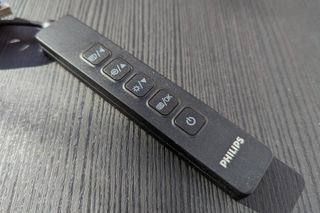 A remote for a Philips 242B1TFL monitor sitting on a desk