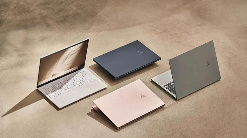 A selection of ASUS notebooks laid out on a desk