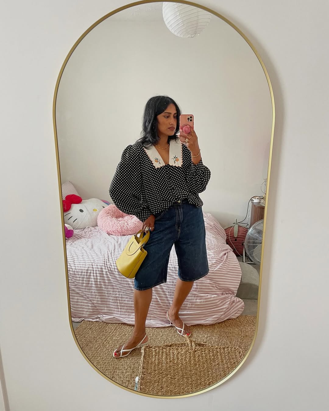 Chiara in long denim shorts and polka-dot blouse