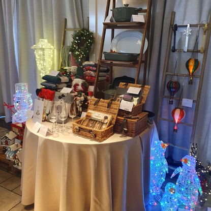 Aldi's Christmas Specialbuys displayed on a round table at the retailer's Christmas press preview for 2026