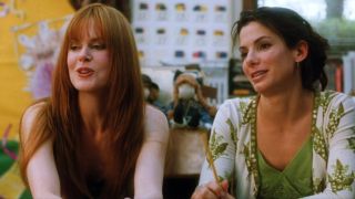 Sandra Bullock and Nicole Kidman watching someone in Practical Magic.