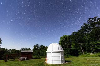 The International Space Station streaks across the New Jersey sky in this image by astrophotographer Gowrishankar L. It flew over an observatory at Jenny Jump State Forest for about five minutes on June 3, 2017, taking just enough time for the stars to leave small trails in the photo as they circle around the North Star.
