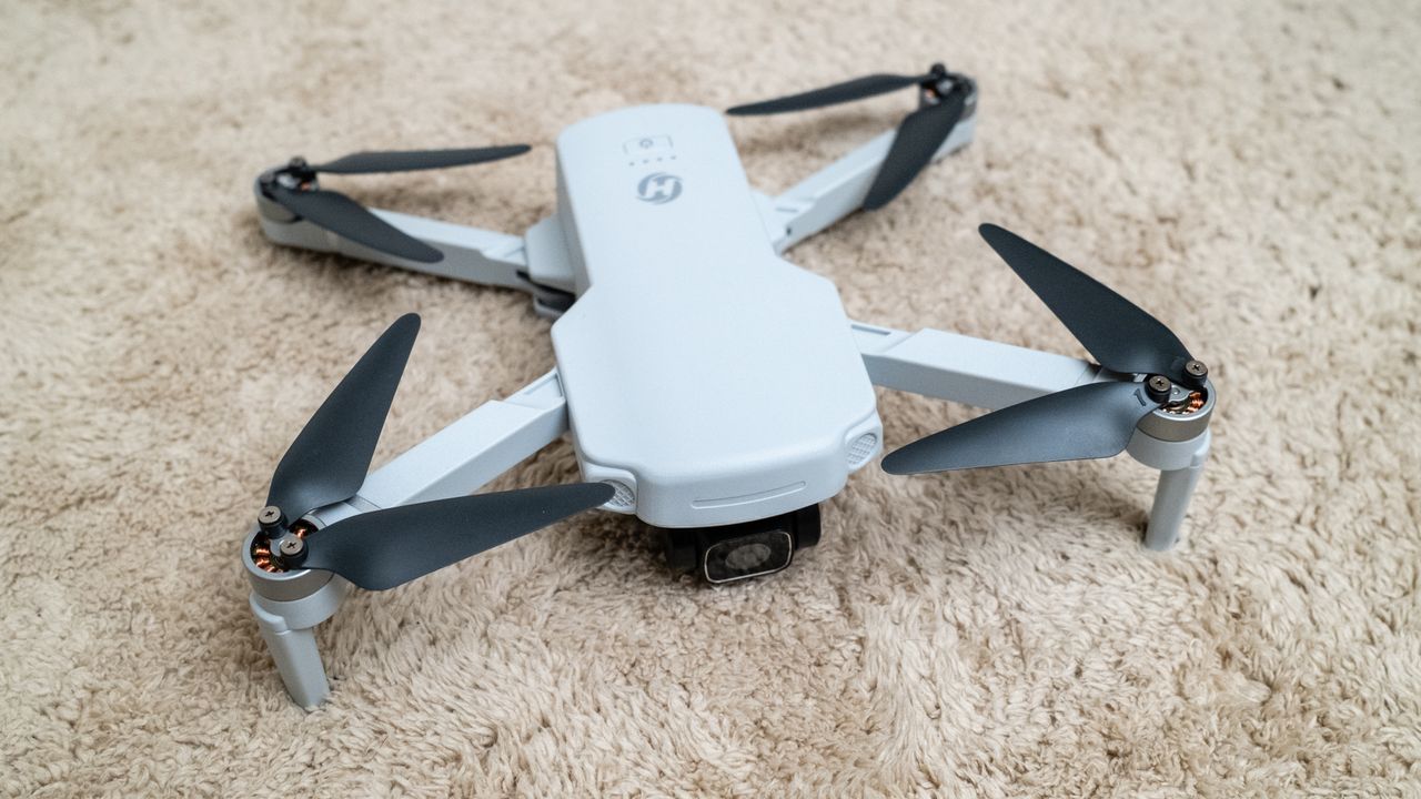 Holy Stone HS360E on a beige carpet