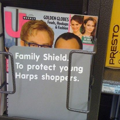 Elton John and David Furnish - Elton John and baby picture covered with 'family shield' - Elton John - David Furnish - Harps - Celebrity News- Marie Claire - Marie Claire UK