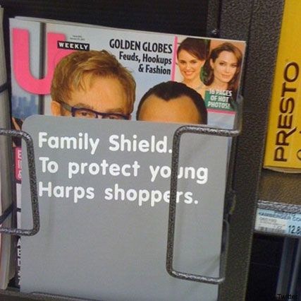 Elton John and David Furnish - Elton John and baby picture covered with &#039;family shield&#039; - Elton John - David Furnish - Harps - Celebrity News- Marie Claire - Marie Claire UK