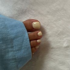 A picture of a soft yellow pedicure