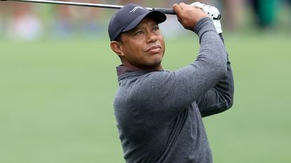 Tiger Woods takes a shot in a practice round before the 2024 Masters