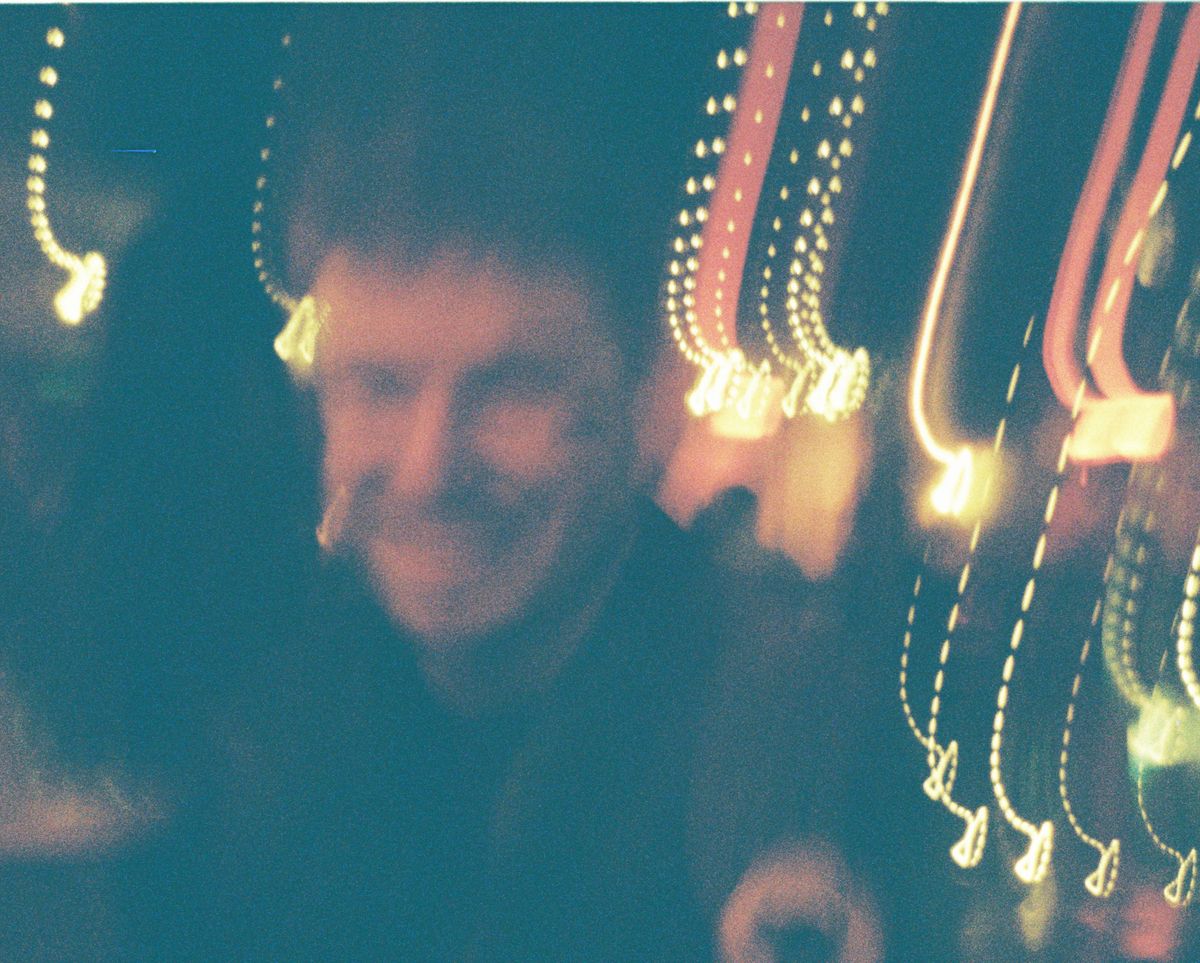 A blurry of a person at night, taken on a Lomography Lomomatic 110 film camera