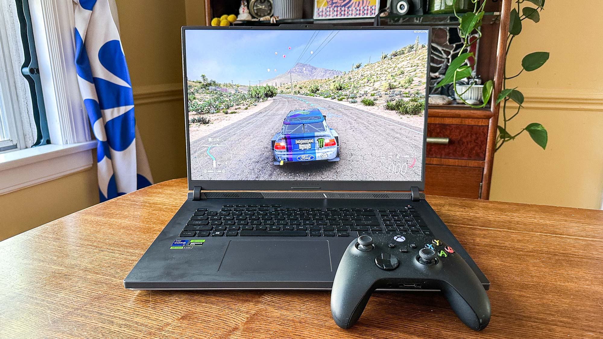 ASUS ROG Strix G18 gaming laptop with an Xbox controller