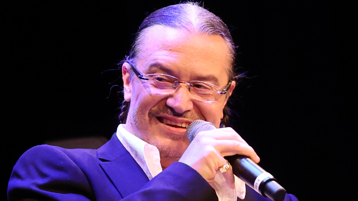 Mike Patton holding a microphone