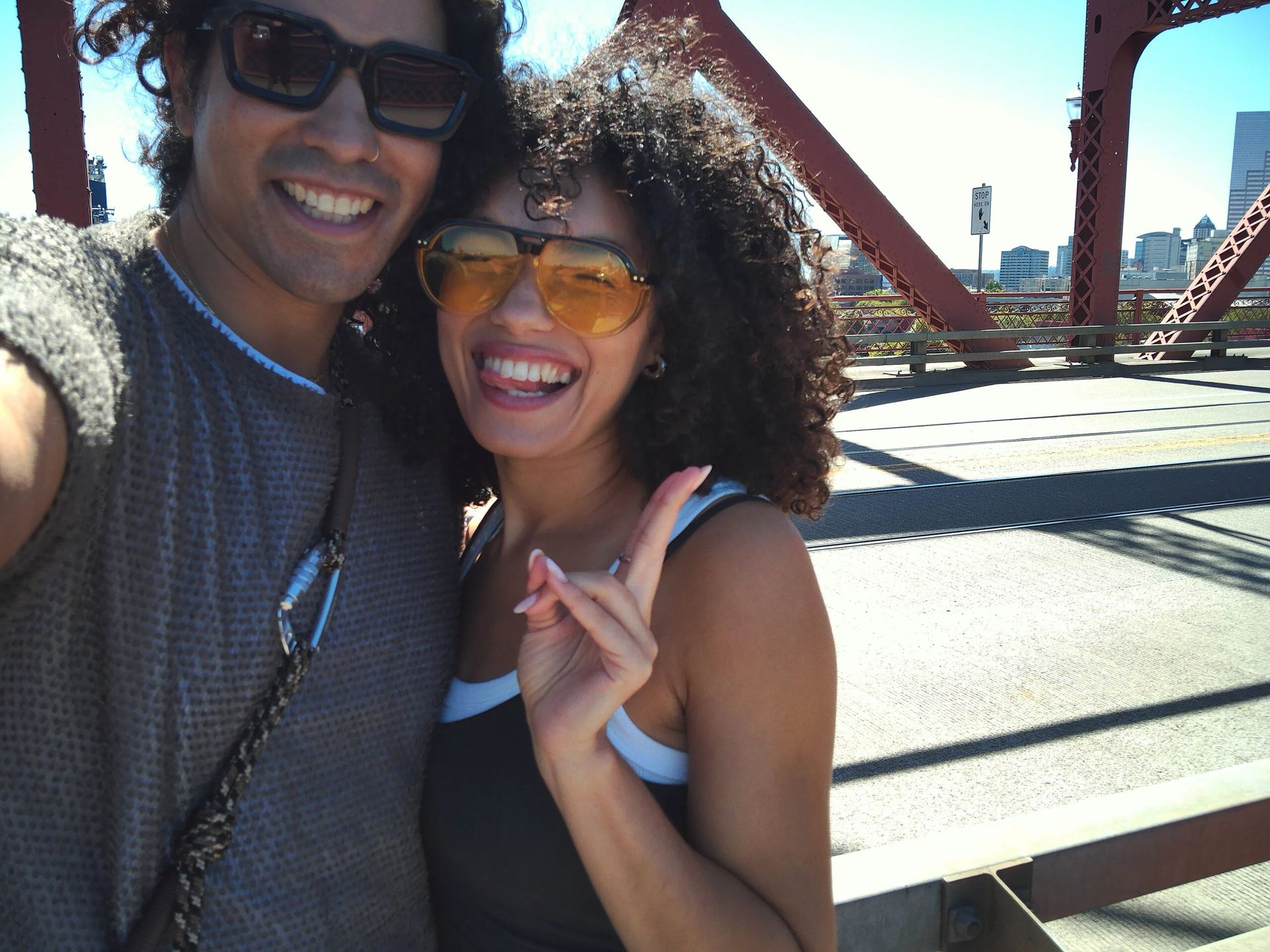 Sample image taken with Portal AFN7 showing a young couple posing for a selfie on a bridge
