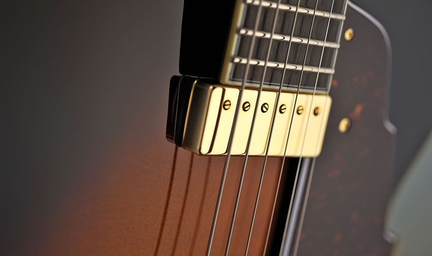 This floating Kent Armstrong pickup attaches to the pickguard, not the neck or the top of the guitar