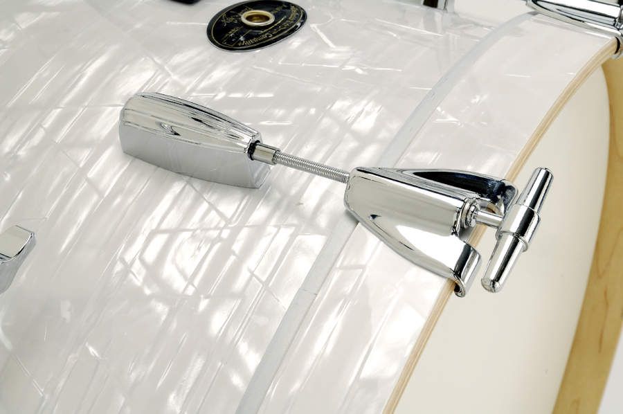 Both resonant and top heads are single-ply with a dense white coating