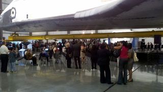 Crowds beneath the tiled underbelly of Endeavour during a pre-opening press tour.