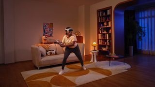 Photo of a woman working out in a living room while wearing the Pico 4 VR headset.