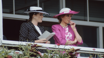 British Royals Sarah, Duchess of York, wearing a dark blue outfit with white polka dots and white wide brim hat with a dark blue band, and Diana, Princess of Wales (1961-1997), wearing a pink Catherine Walker suit with a white silk floral blouse, and a matching pink-and-white hat by Philip Sommerville, attend the Derby Day meeting at Epsom Downs Racecourse in Epsom, Surrey, 3rd June 1987