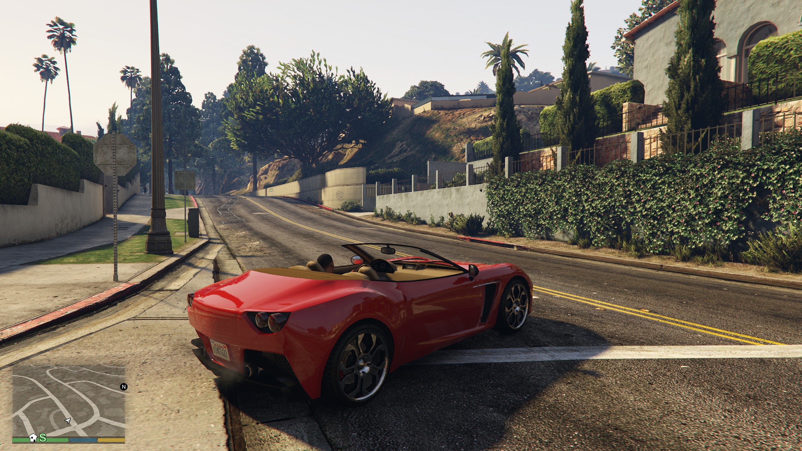 A red car in the middle of a street in GTA 5 Enhanced