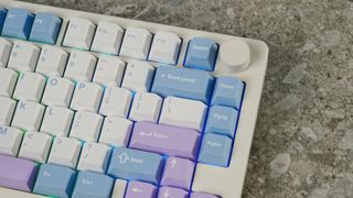 A pink, blue and white Gamakay TK75 Pro wireless mechanical keyboard with hot-swappable linear switches