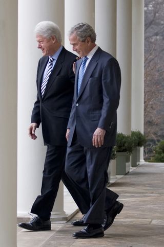 President George Bush and Clinton walking together