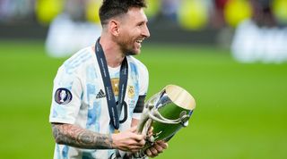 Argentina captain Lionel Messi celebrates with the Copa America trophy in 2021.