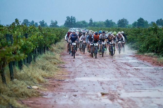 Riders leave Arabella Wines in the rain during stage 2