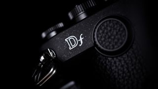 Close-up image of Nikon Df, showing 'Df' logo, on a black background 