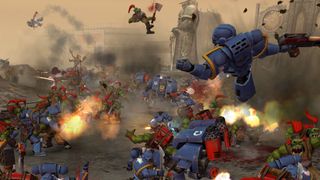 Space Marines and Orks in battle.