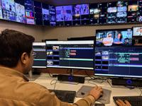 Man using Grass Valley solutions on a computer at Asian News International