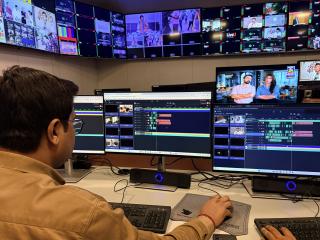 Man using Grass Valley solutions on a computer at Asian News International