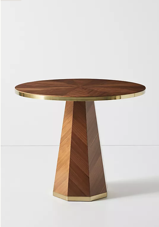 Wooden pedestal dining table from Anthropologie.