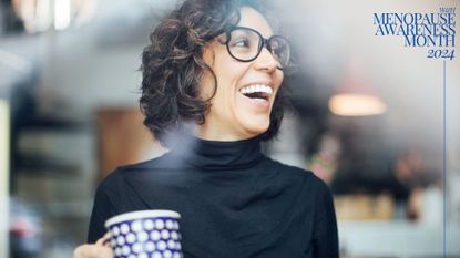 Woman holding up cup of coffee, wearing glasses, laughing and smiling, representing what happens when you come off HRT