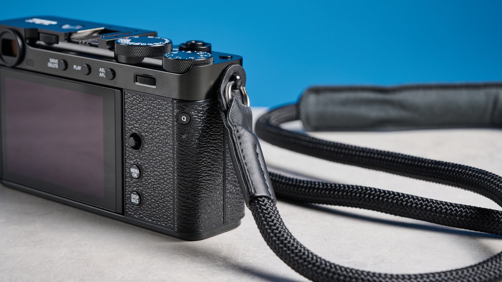 Fujifilm X-E5 against a blue background
