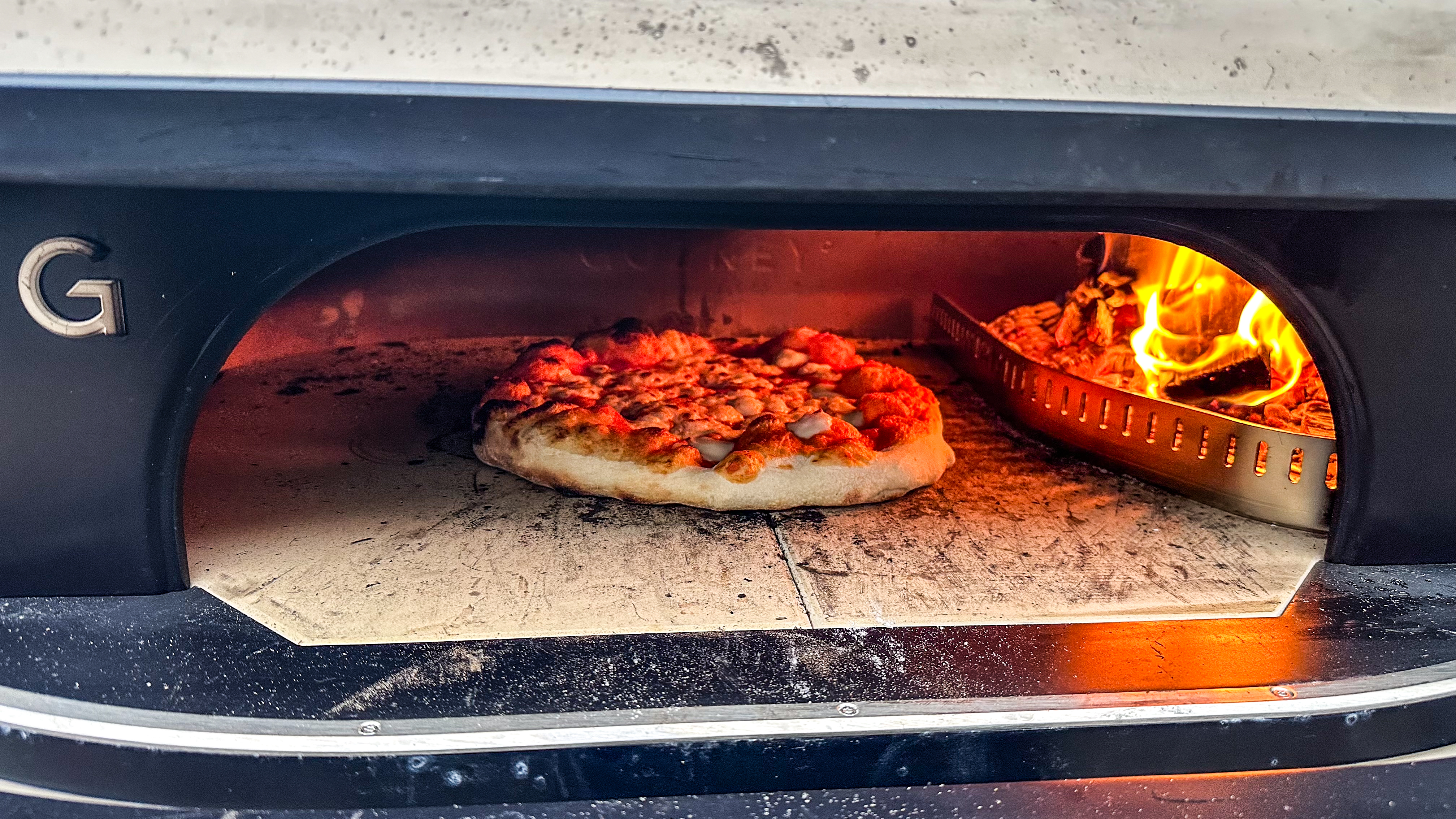 Gozney Dome XL gen 2 wood fire with pizza