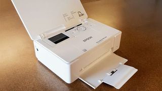 Epson PictureMate PM-400 Wireless Photo Printer being tested in writer's home