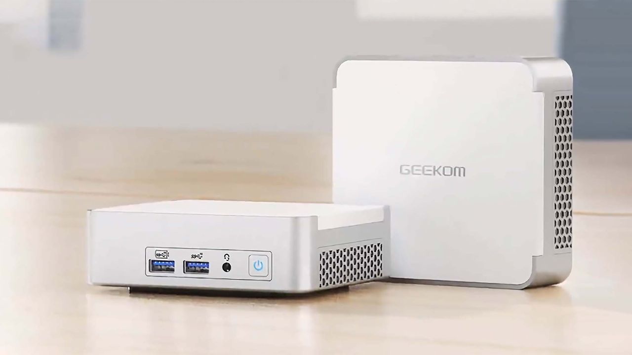 Geekom XT12 Pro Mini PC on desk.