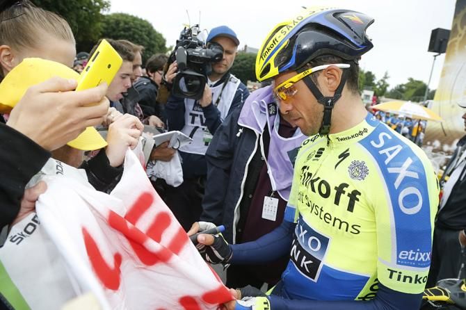 Alberto Contador (Tinkoff-Saxo) signs autographs before the start of stage 7