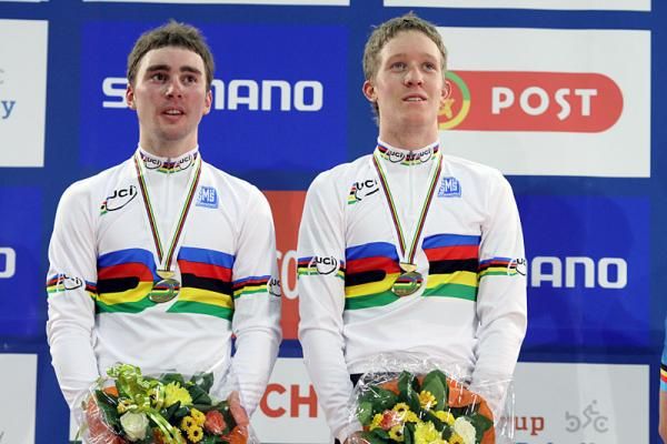 All eyes on the Australian flag for Leigh Howard and Cameron Meyer as the national anthem plays for their victory in the men's Madison.