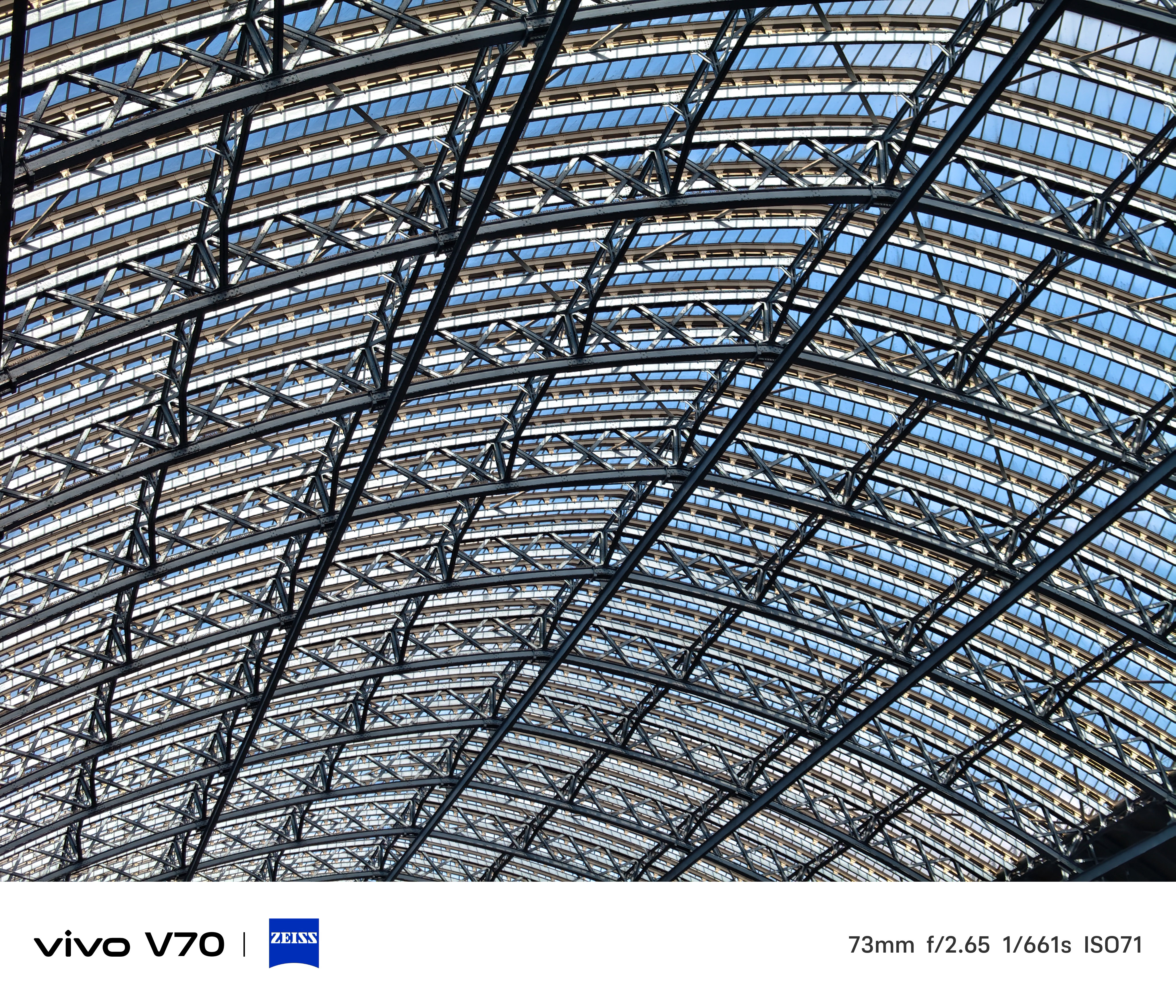 Close-up of the steel and glass lattice roof structure inside St Pancras International.
