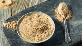 Bowl of maca powder, one of the adaptogens