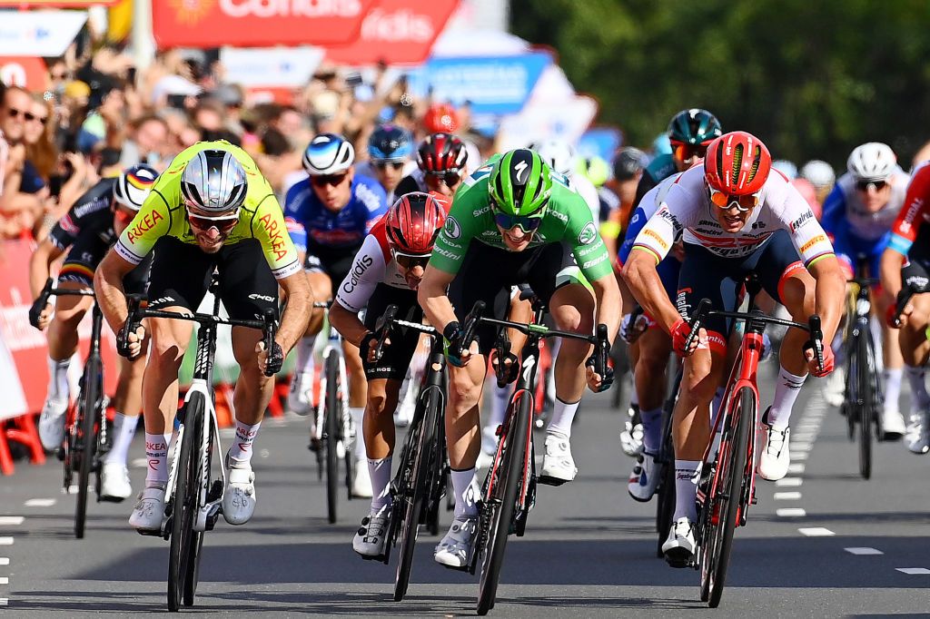 BREDA NETHERLANDS AUGUST 21 Sam Bennett of Ireland and Team Bora Hansgrohe Green Points Jersey Mads Pedersen of Denmark and Team Trek Segafredo and Daniel Mclay of United Kingdom and Team Arka Samsic sprint to win during the 77th Tour of Spain 2022 Stage 3 a 1932km stage from Breda to Breda LaVuelta22 WorldTour on August 21 2022 in Breda Netherlands Photo by Tim de WaeleGetty Images