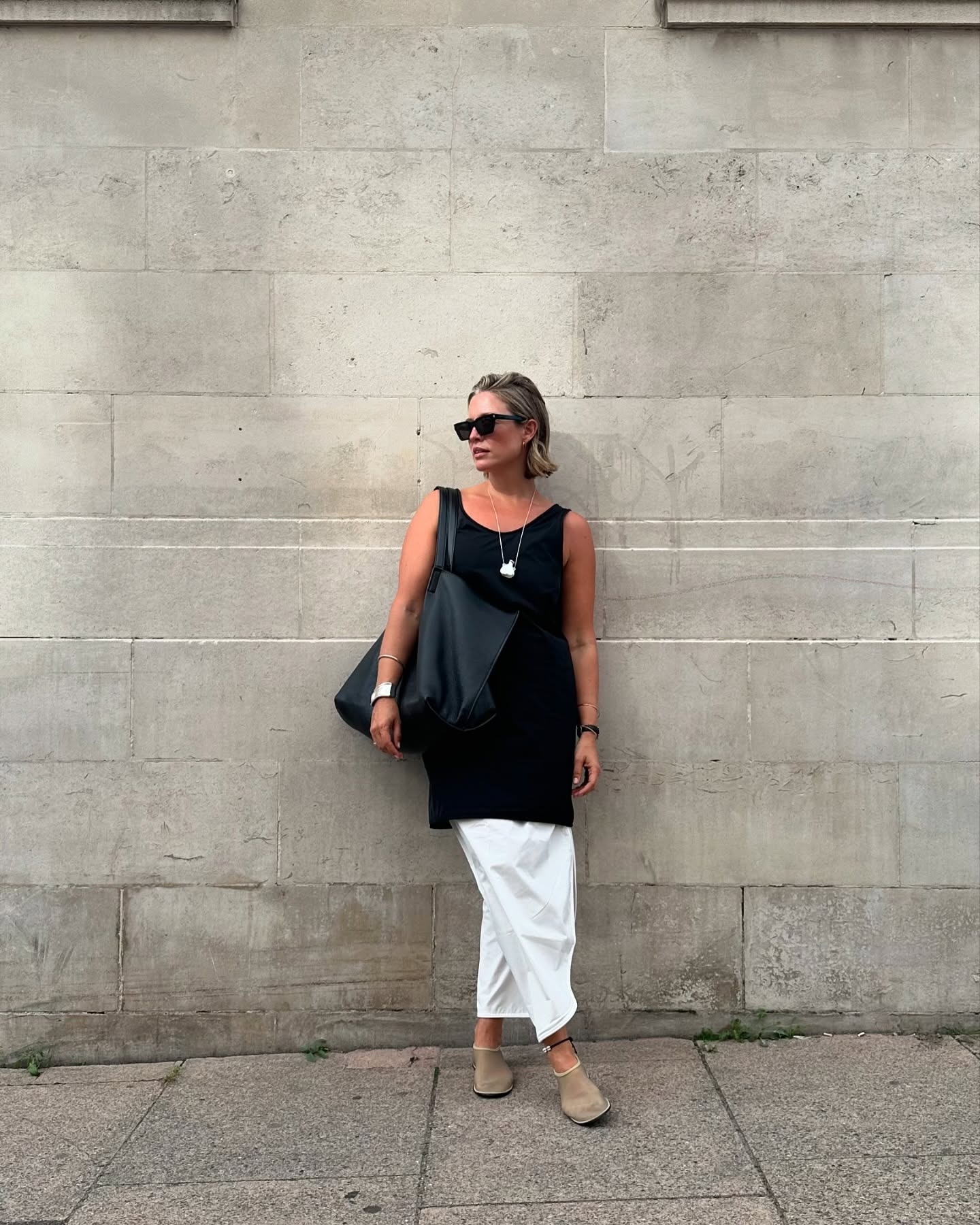 Alexis Foreman wears The Row mesh flat shoes.