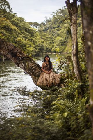  AMAZON RAINFOREST, ECUADOR. More and more tribes of Amazonia are starting to adopt modern clothes for everyday life. But they are still keeping their traditional clothes for important events. I photographed this young woman in her wedding outfit.