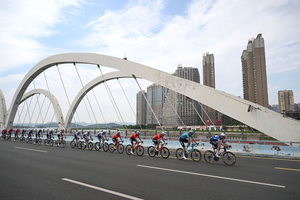 FANGCHENGGANG CHINA OCTOBER 15 LR Yutao Shen of China and Team China Yevgeniy Fedorov of Kazakhstan and Astana Qazaqstan Team Josef Cerny of Czech Republic and Team Soudal QuickStep and general view of the peloton competing during the 5th GreeTour Of Guangxi 2024 Stage 1 a 1493km stage from Fangchenggang to Fangchenggang UCIWT on October 15 2024 in Fangchenggang China Photo by Dario BelingheriGetty Images