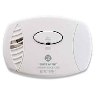 A white carbon monoxide alarm with grey text