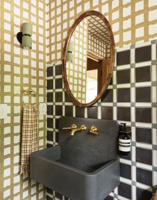 a bathroom with mix and match tiles