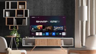 Sharp Aquos Xumo TV on stand in living room