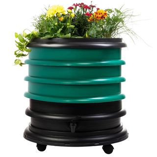 green wormery composter bin with a plant lid