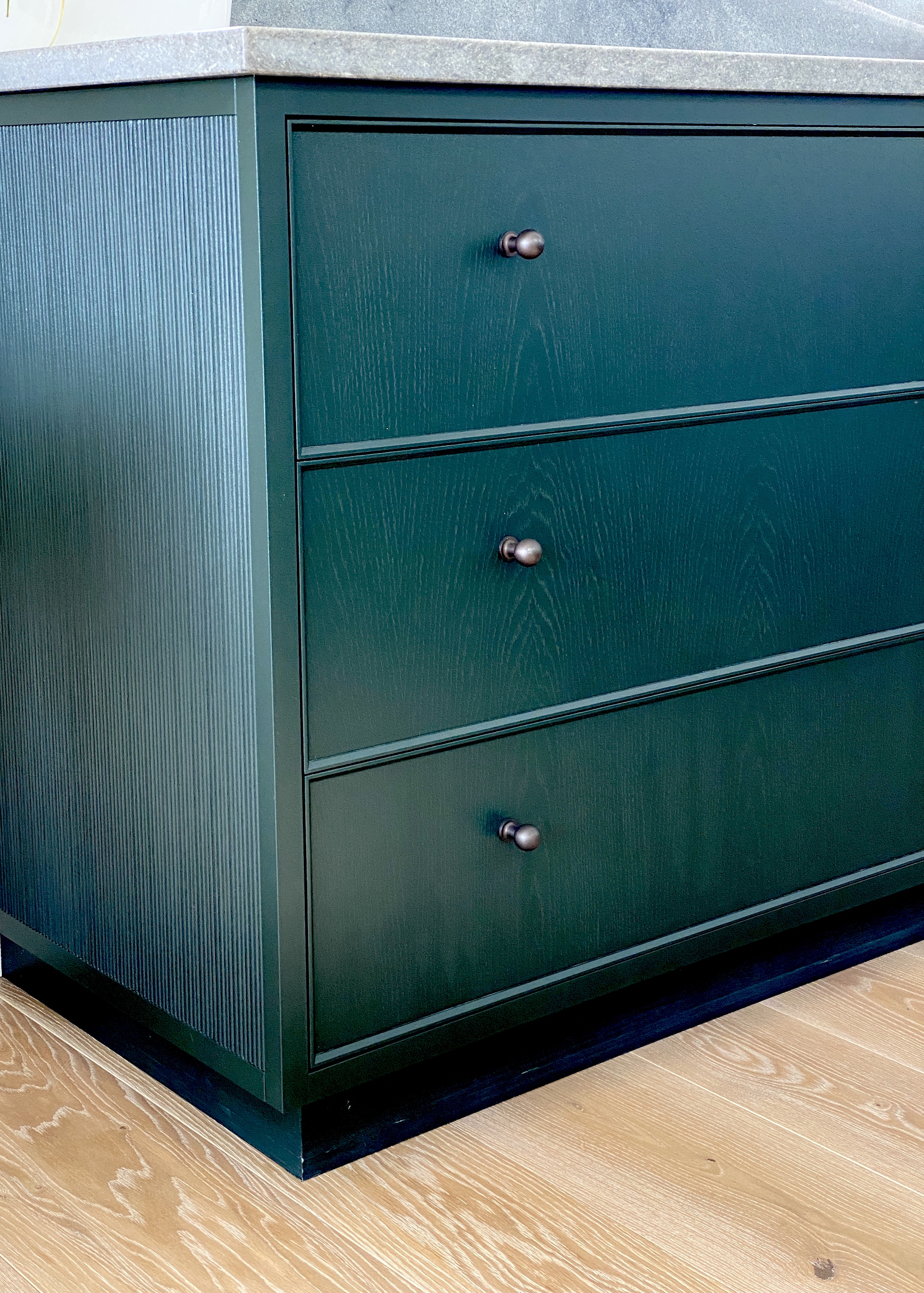 green kitchen drawer cabinets and wood floor