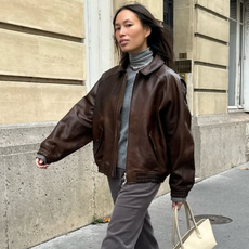 french woman wearing brown leather jacket outfit