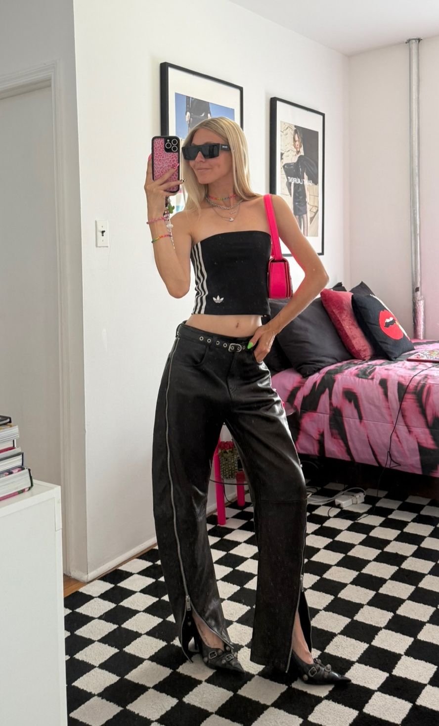 Jessica Minkoff posing in mirror wearing adidas tube top and leather pants